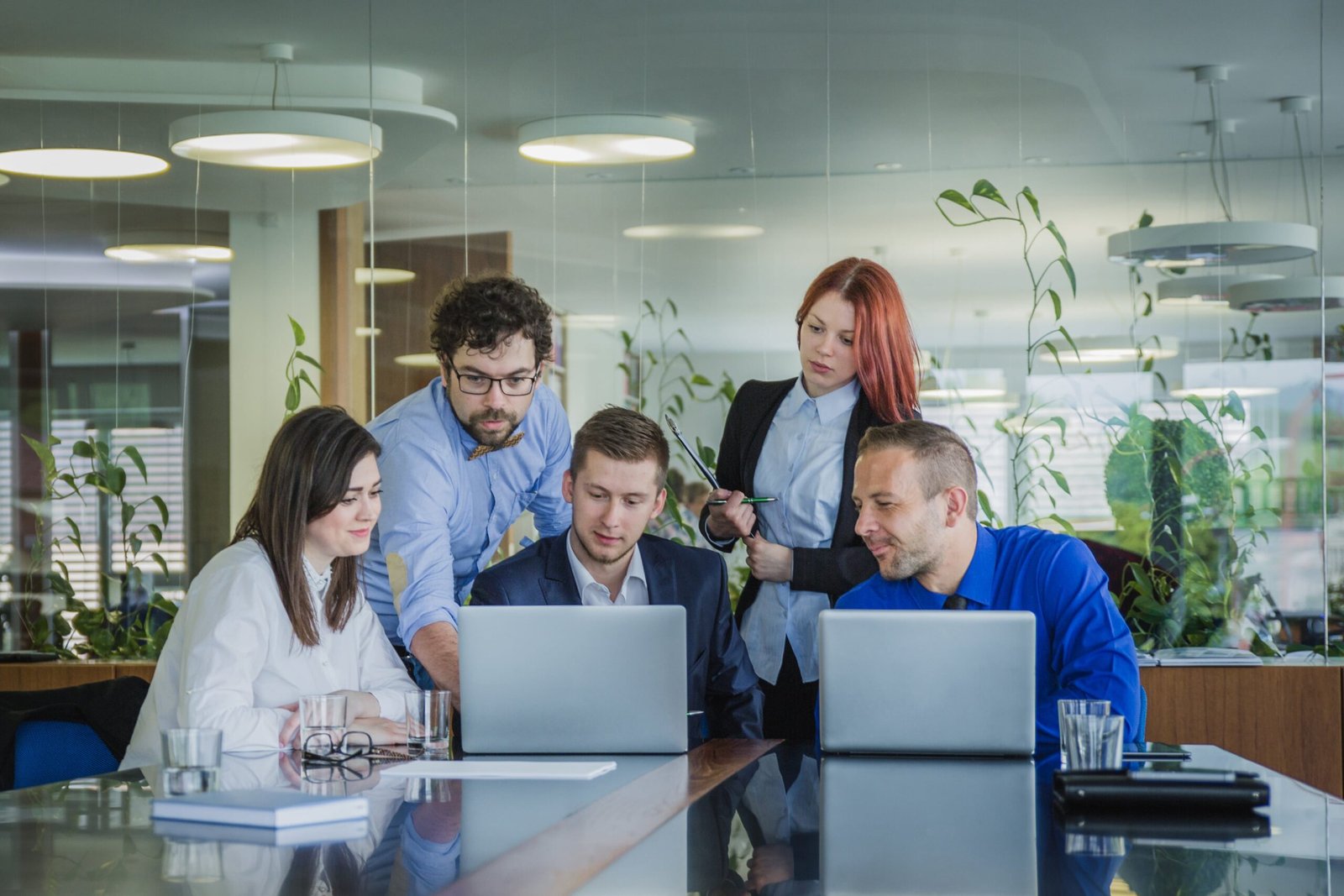 people-with-laptops-office-min